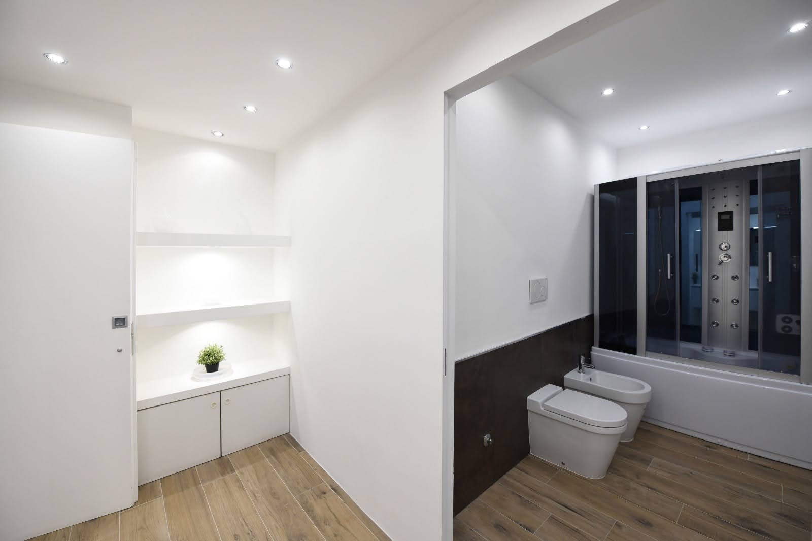 Private wellness bathroom in Milan with jacuzzi bathtub, steam shower and ante-bathroom view